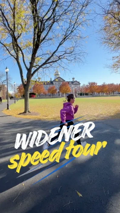 Student running on campus with Old Main in the background
