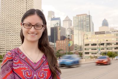 student with philadelphia skyline