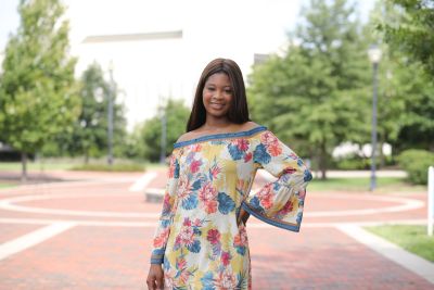 Arianna McRae standing on campus