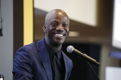 Shaun Harper speaking at a microphone