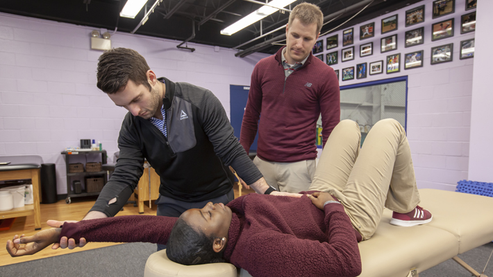 pt student working with alum