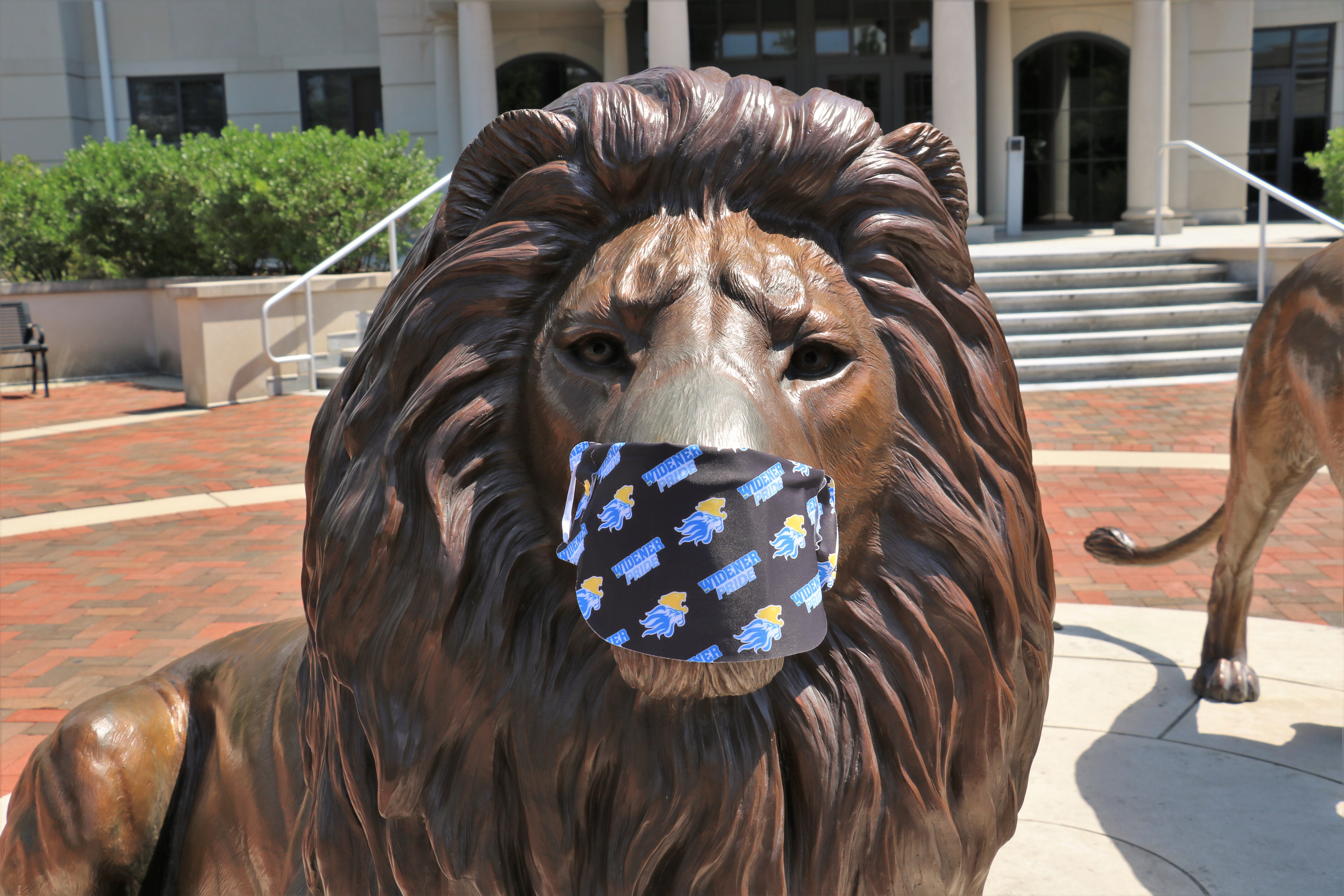 Lion statue wearing mask