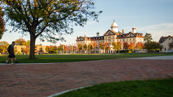 Old Main from a distance in fall 710x400 Fall day on Widener's campus with Old Main, the university's flagship building, in the background
