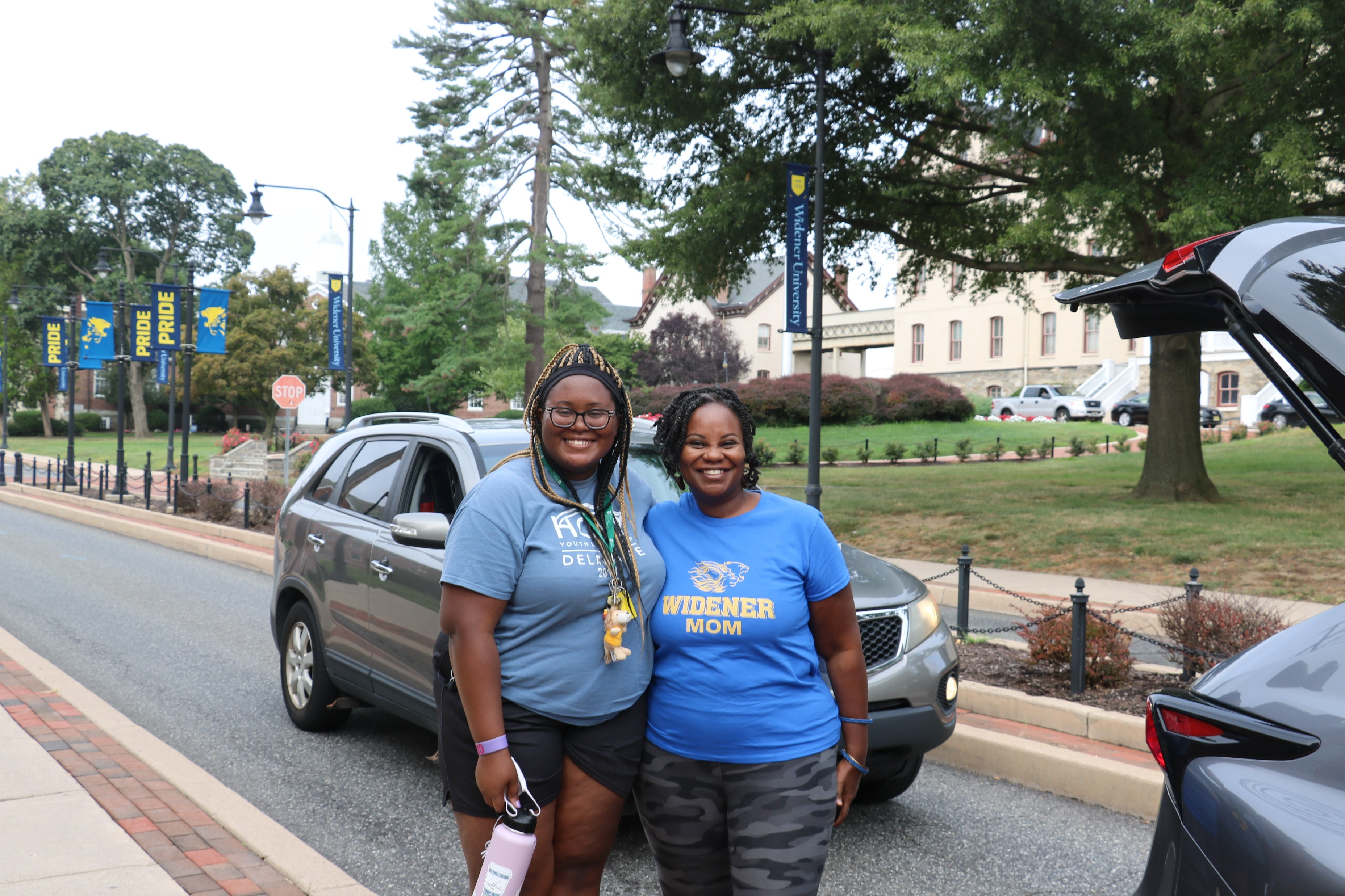 A mother and daughter pose at move-in