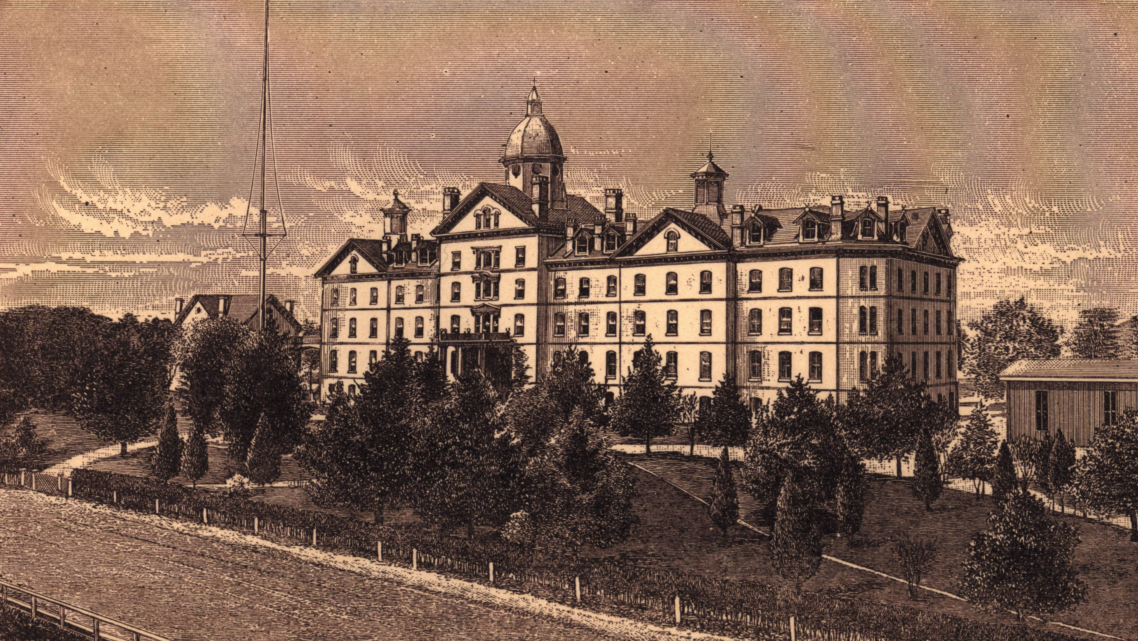 Historic image of front of Old Main in sepia tones