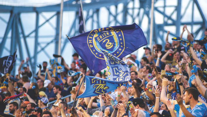Philadelphia Union fans wave flags at the Subaru Park stadium.