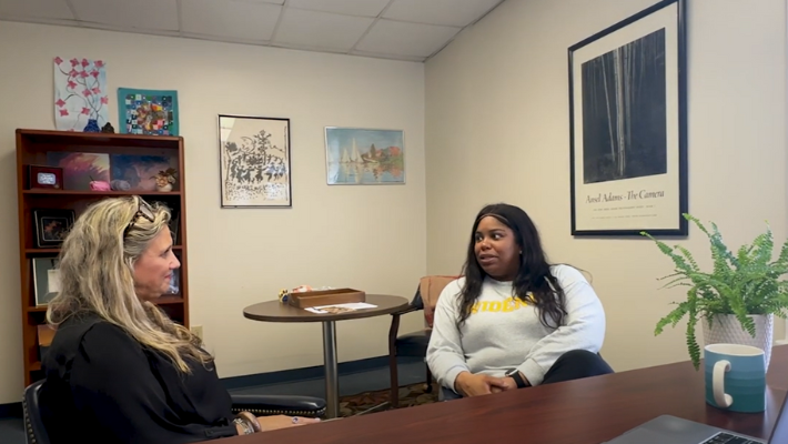 A Widener University social work student receives pro bono clinical supervision at a professor's office.