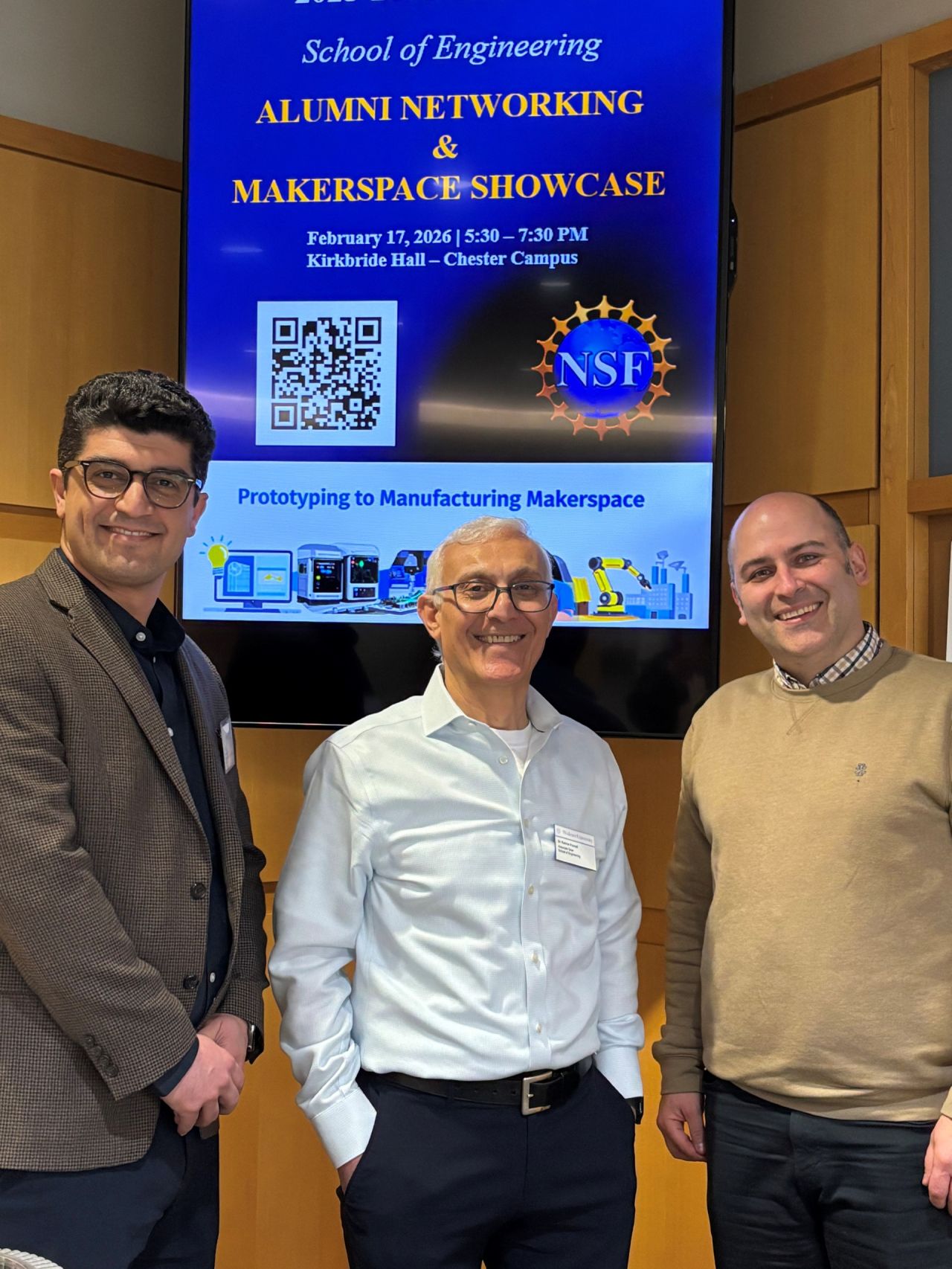 Three male engineering faculty members pose for a picture.