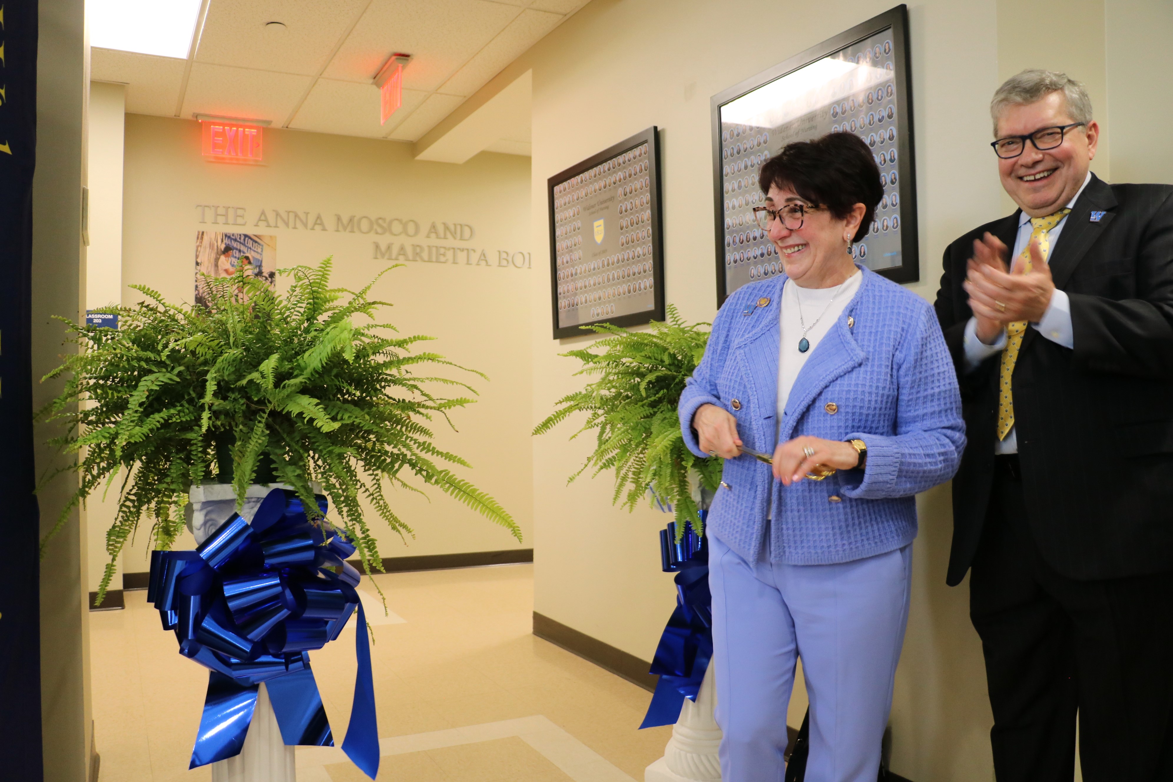 Marietta and Michael Borinski cut the ribbon outside the lab.