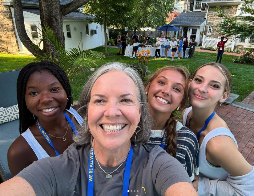 President Robertson takes a selfie with first year students.