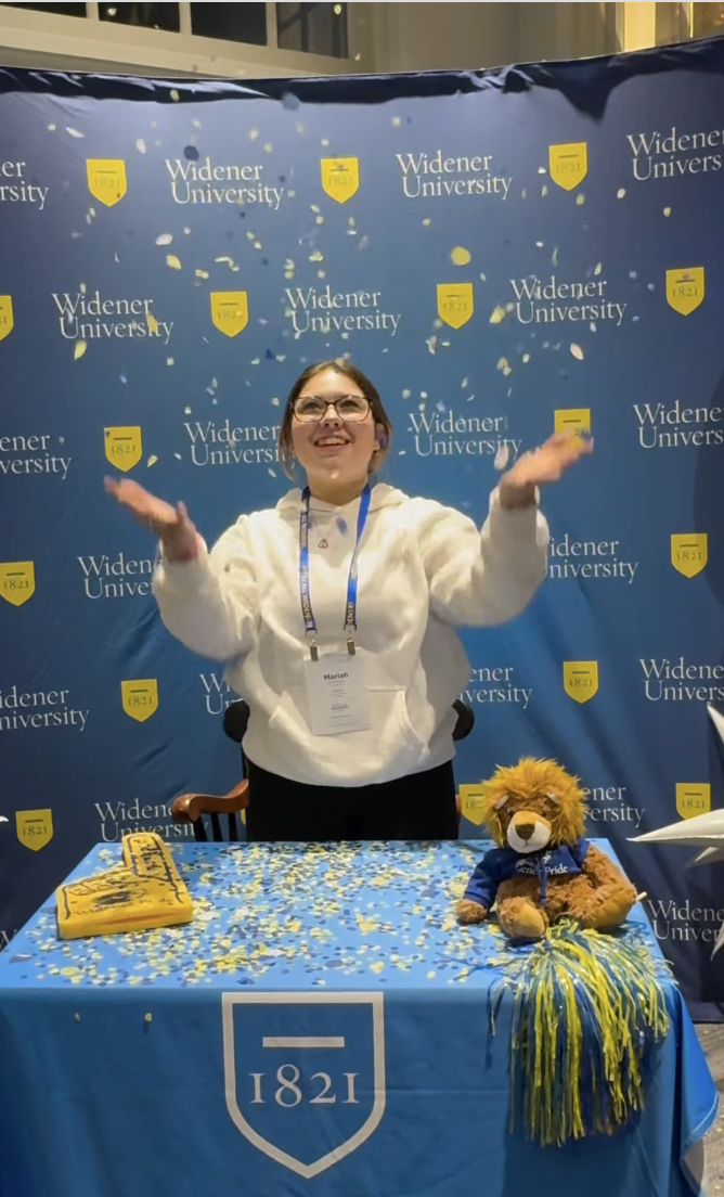 admitted student throws confetti