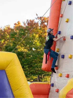 A Widener student rock climbing