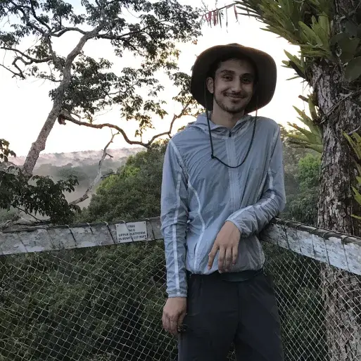 Student Zan Usmani standing in the Amazon rainforest in Peru
