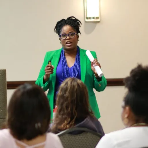 Tanya Bass speaks to a conference of sexuality professionals