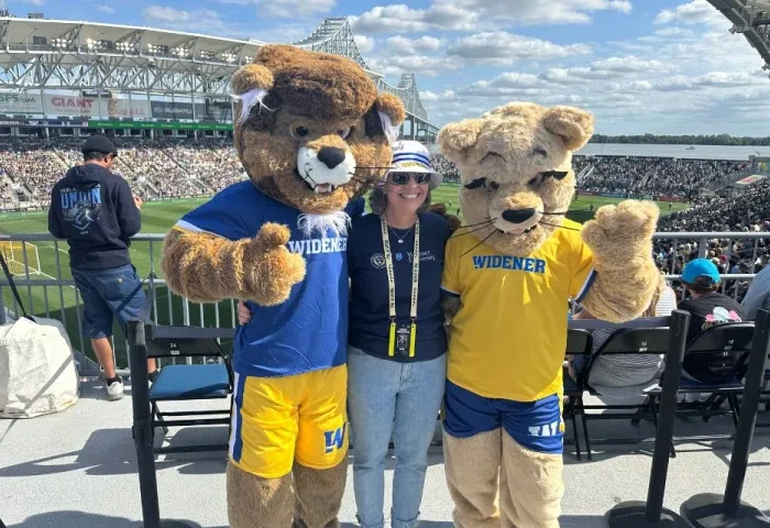 Widener Union title match header 960 x 640 Chester, President Stacey Robertson, and Melrose pose at the Philadelphia Union soccer stadium.