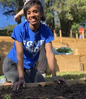 Civic Engagement Planting Student 