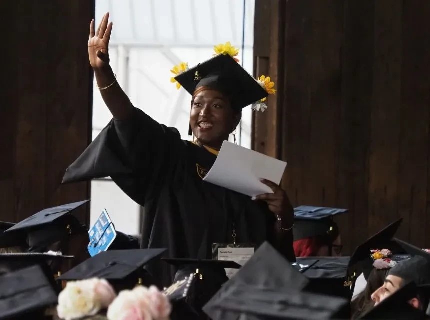Graduating Waving at Commencement