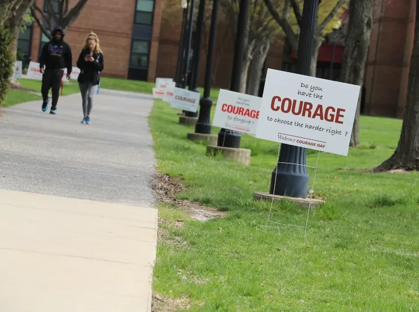 Courage Day signs and students on campus