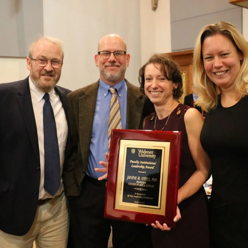 Janine Utell and other faculty at the awards banquet