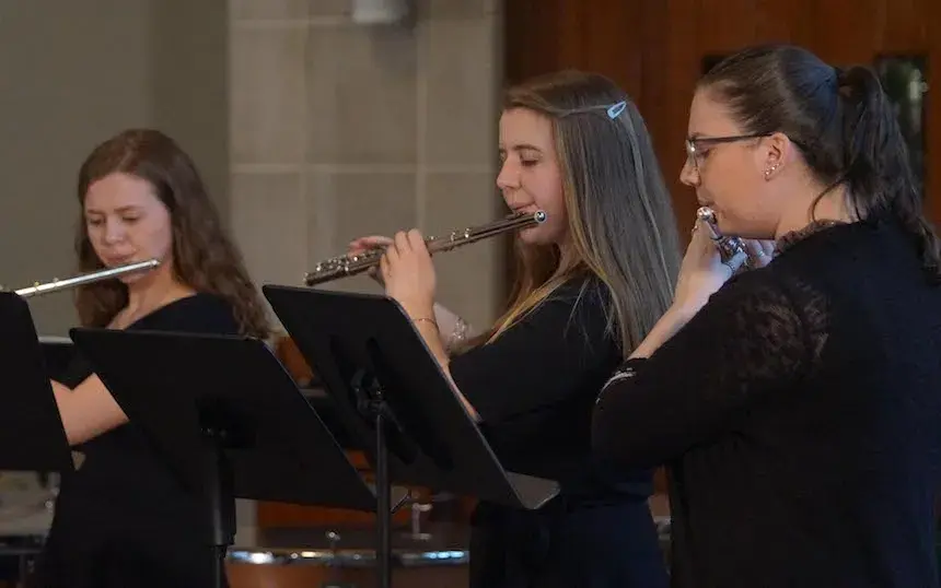 Widener Band Members Playing Flutes