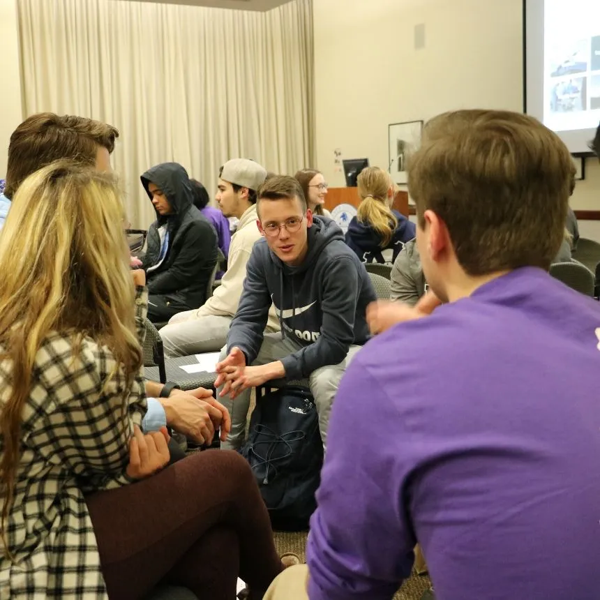 Students discuss political issues at watch party