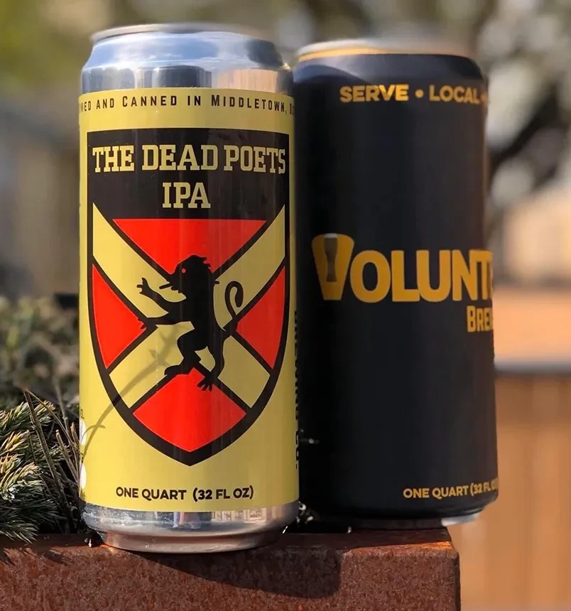 Two Volunteer Brewing Co. beer cans, one for Dead Poets IPA