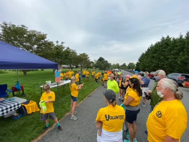 Volunteers in yellow shirts taking part in Day of Service organized by Volunteer Brewing Co