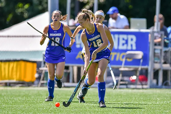 Widener field hockey player tracking down a ball