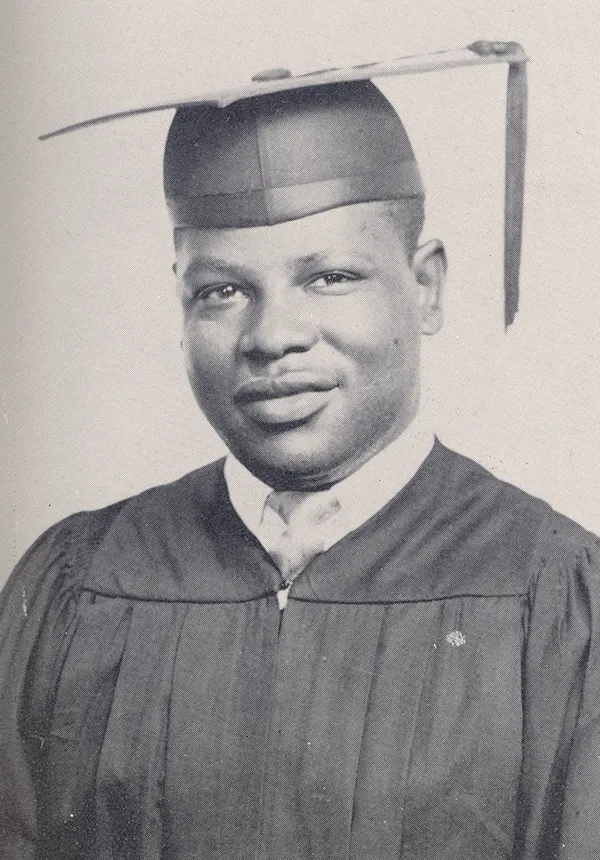 Black and white photo of Howard Scott in cap and gown