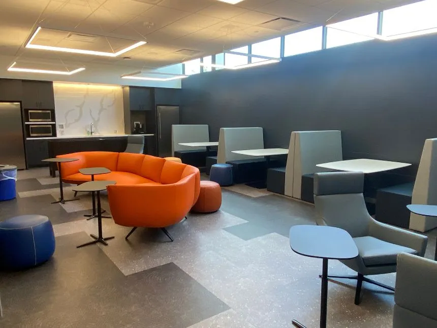 One of the three student study areas features a full kitchen, tables, and booths for studying and collaboration.