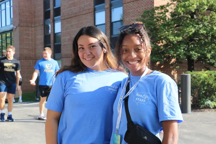 Two resident assistants pose for a photo