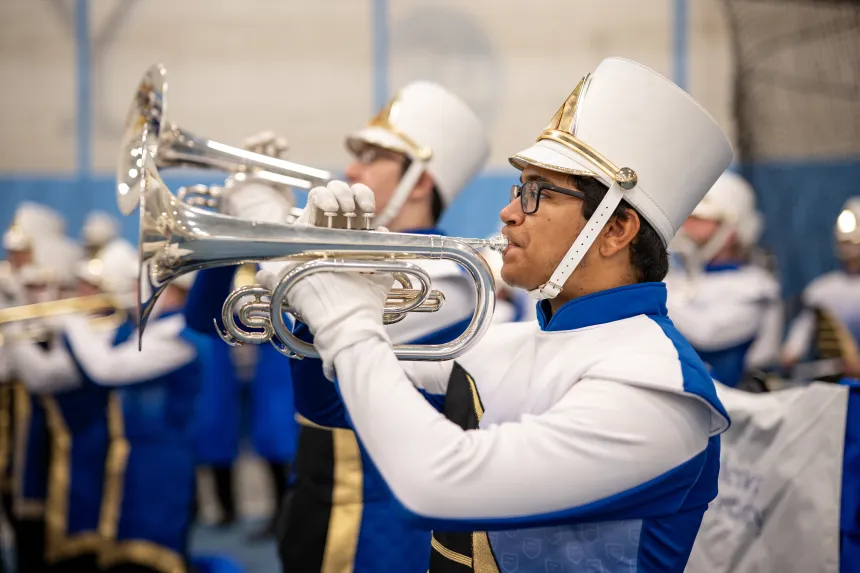 Two marching band trumpeters playing