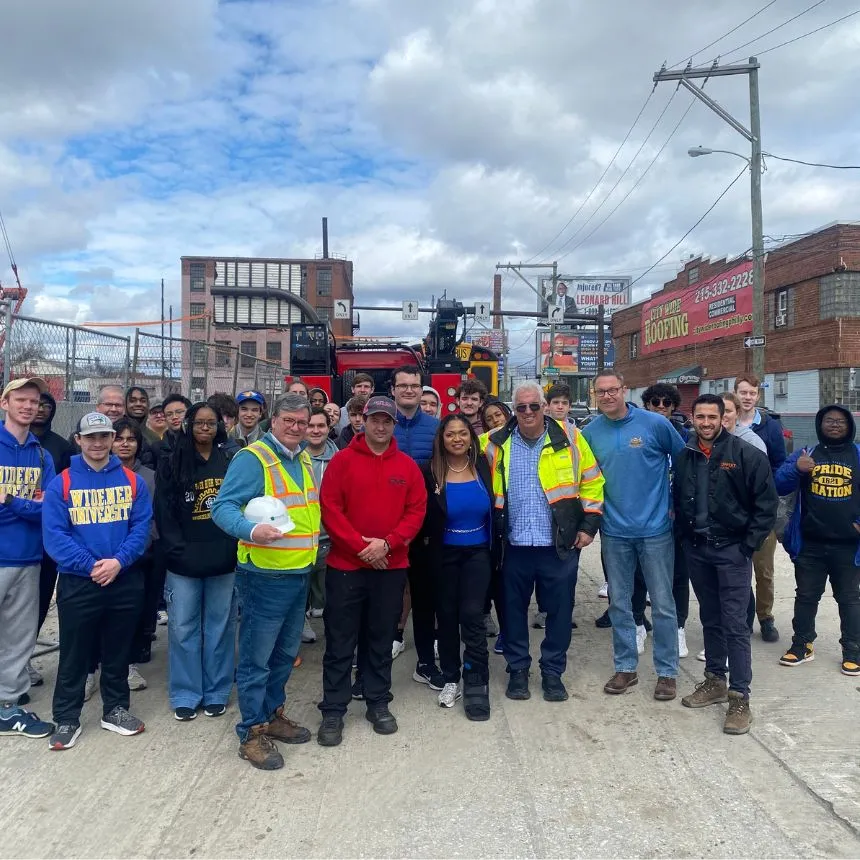 Group shot shows students, faculty, staff.