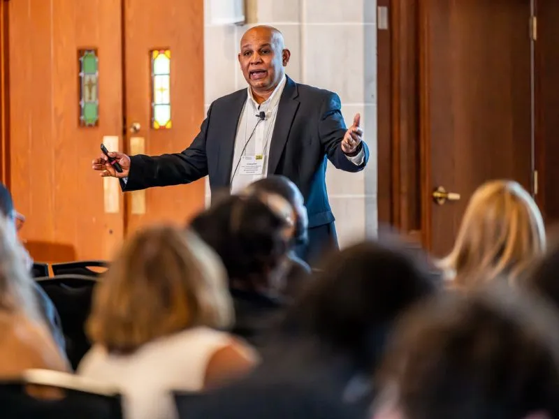 The keynote speaker addresses people in attendance at the Future of Work Conference.