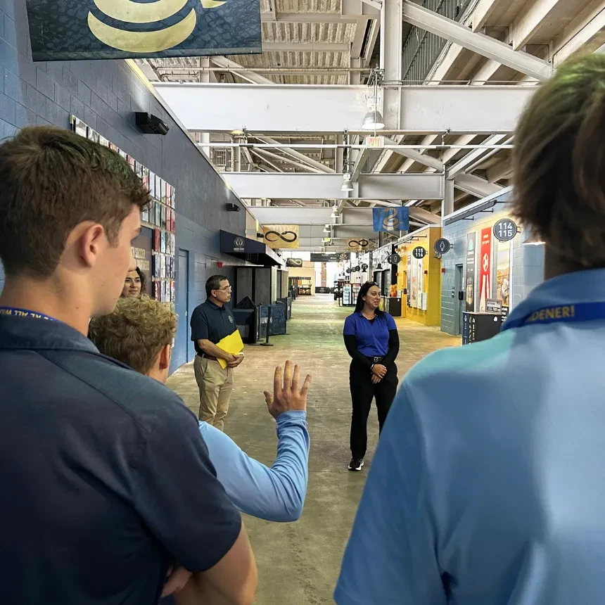 Students listen to a presentation on the concourse at Subaru Park