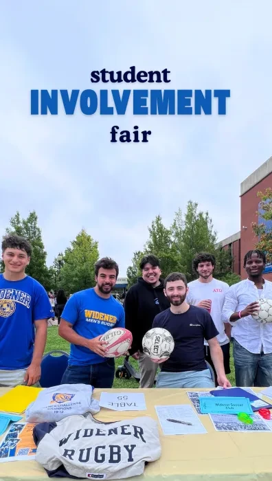 Rugby players standing at a table with the words "Student Involvement Fair" over the image