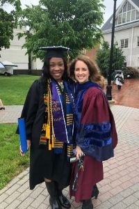 Diamond Schuler Douyon poses with Professor Corbo at her graduation.