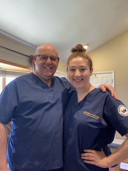 A recent photo of Gary and Stephanie posing together in their scrubs. 