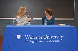 Stacey Robertson and Serena Zabin speaking at a Widener University table