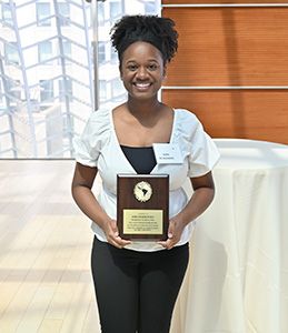 Zora DeSeignora '23 with the Janice Bond Memorial Plaque and Award for Graduating Seniors