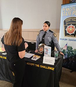 Student speaks with a Pennsylvania State Police Officer