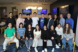 Group of students from ACS Athens pose for a photo in the University Center MacMoreland Commons