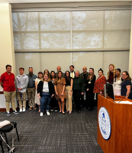 Students and faculty pose for a photo