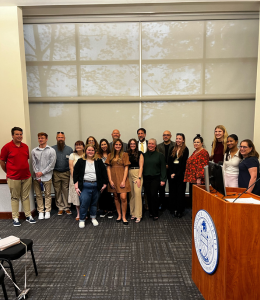 Students and faculty pose for a photo 