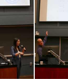 Faculty in front of a computer presenting their work