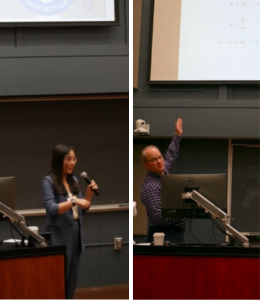 Faculty in front of a computer presenting their work 