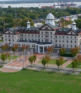 An aerial image of Old Main surrounded by beautiful scenery.