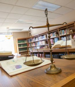 Scales of justice on a counter in a library