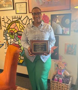 Erika Dawkins poses with her award.