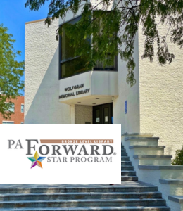 The exterior of Wolfgram Memorial Library with the PA Forward Bronze Star logo over it 